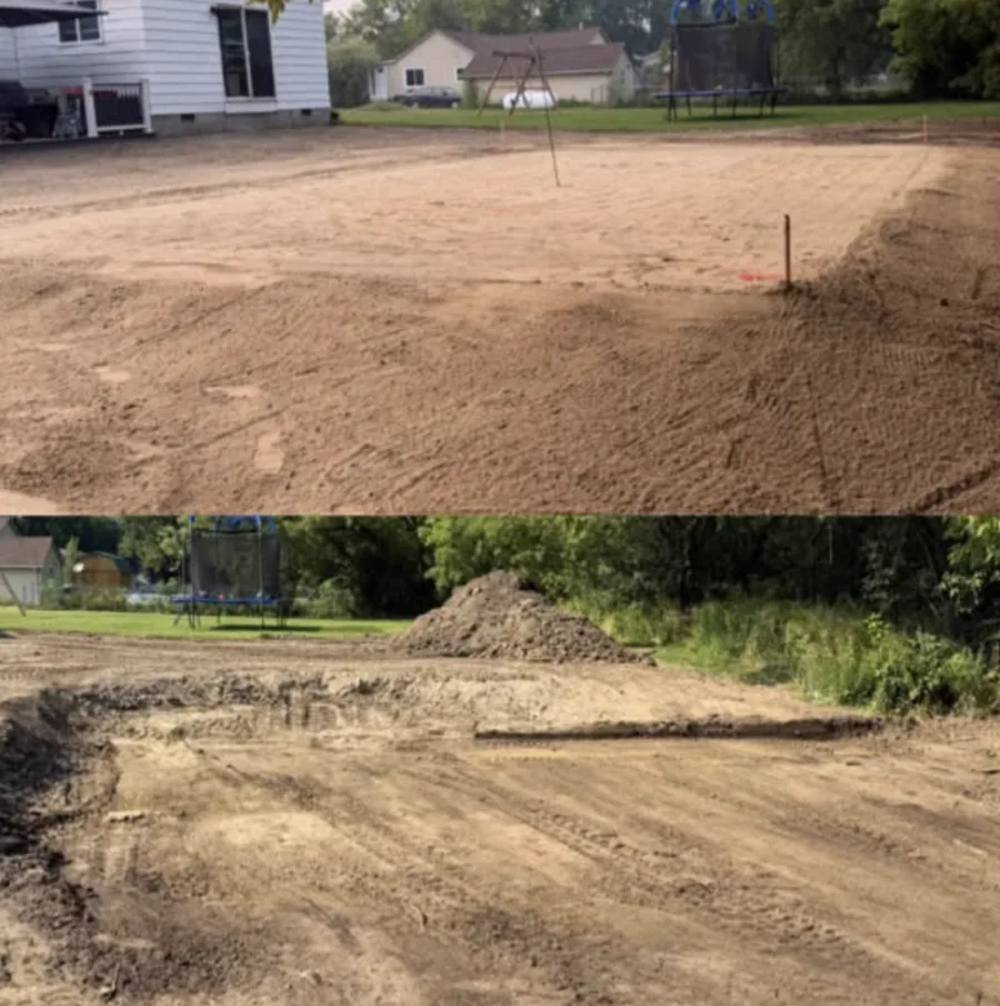 Dirt pad cut and graded level beside a house, with grade stakes in the ground