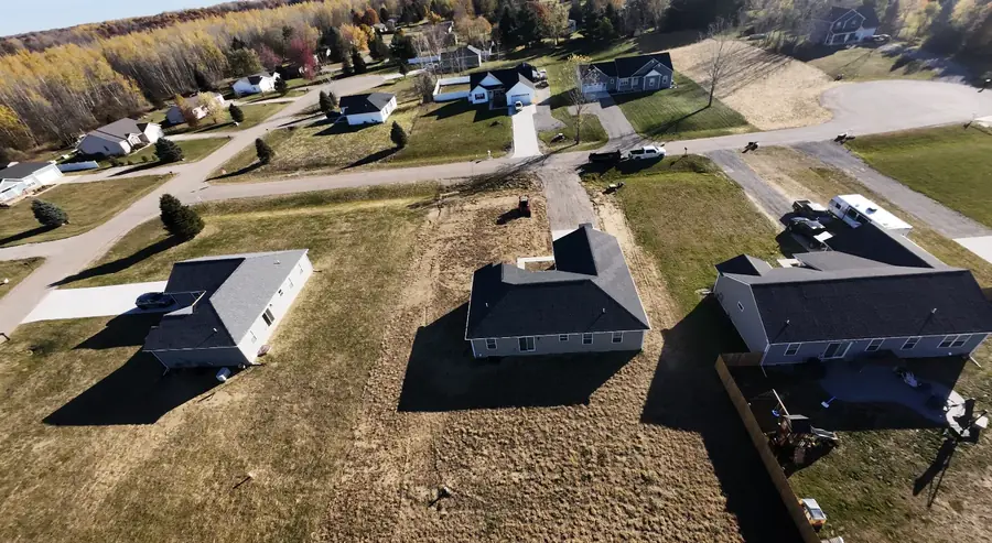 Aerial view of new houses on graded lots in a subdivision