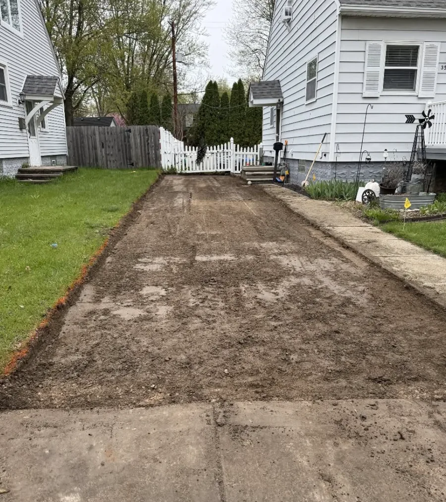 Driveway cut down to a dirt base before the stone goes on